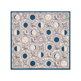The Tiny Finch square silk scarf featuring a blue and white celestial moon phase print with anthropomorphic faces.