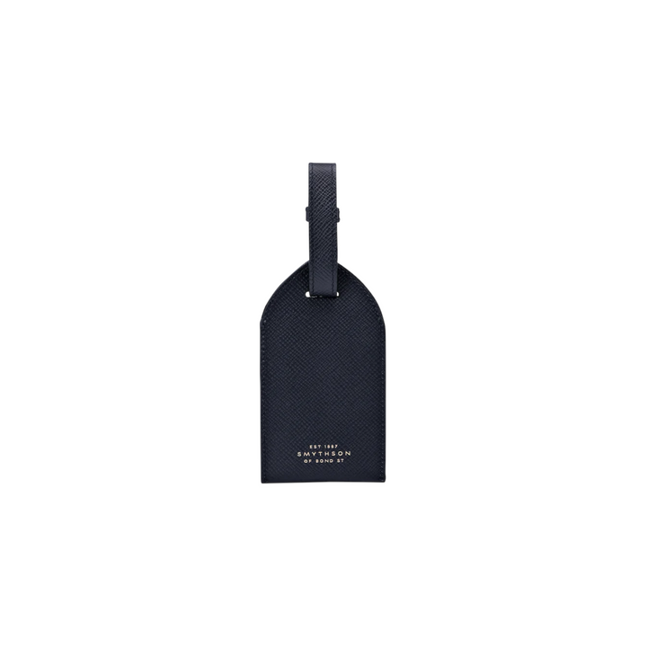 The Tiny Finch Smythson navy crossgrain leather luggage tag with adjustable strap and gold logo detail
