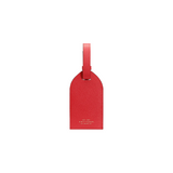 The Tiny Finch red crossgrain leather luggage tag with adjustable strap and gold Smythson logo branding.