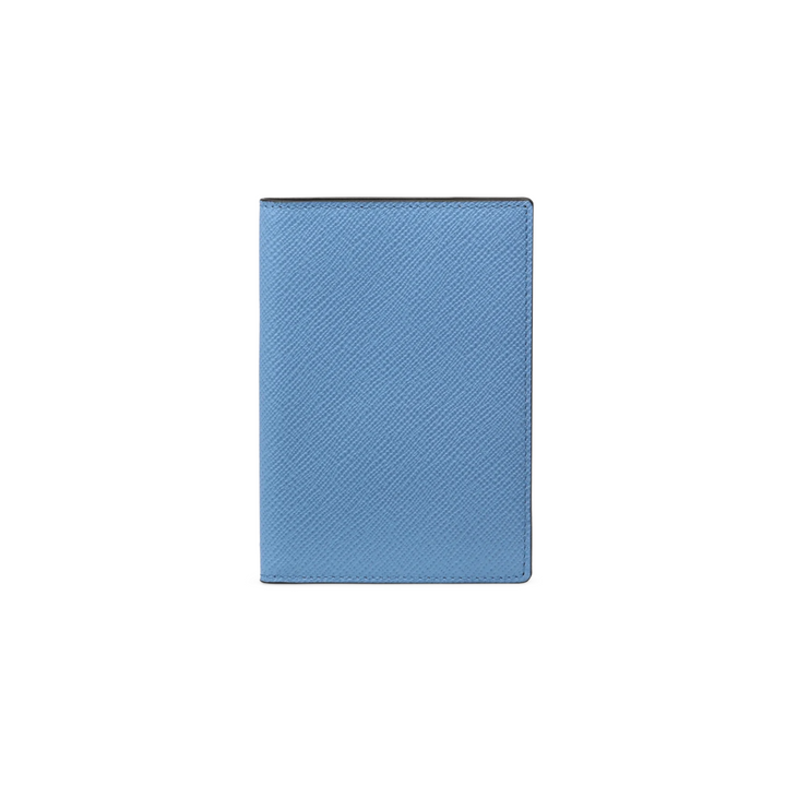 The Tiny Finch blue crossgrain leather passport cover with a textured finish and slim travel design.