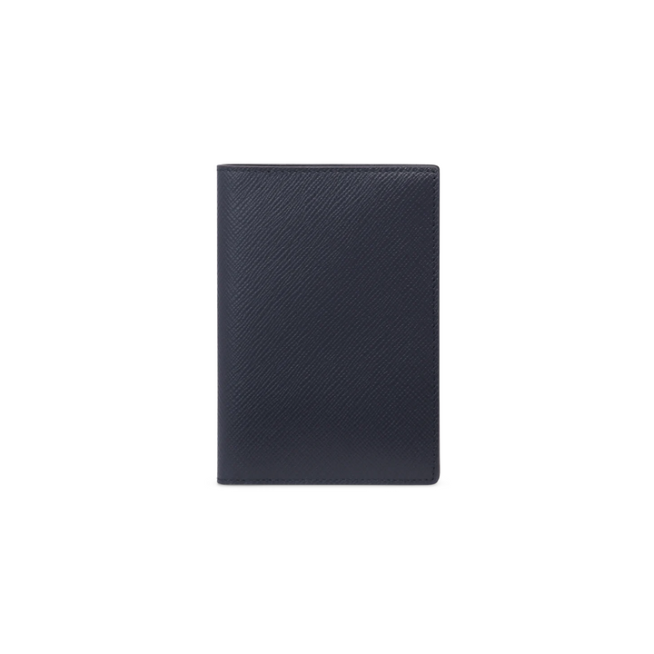 The Tiny Finch navy passport cover in handcrafted crossgrain calf leather with a sleek, minimalist design.