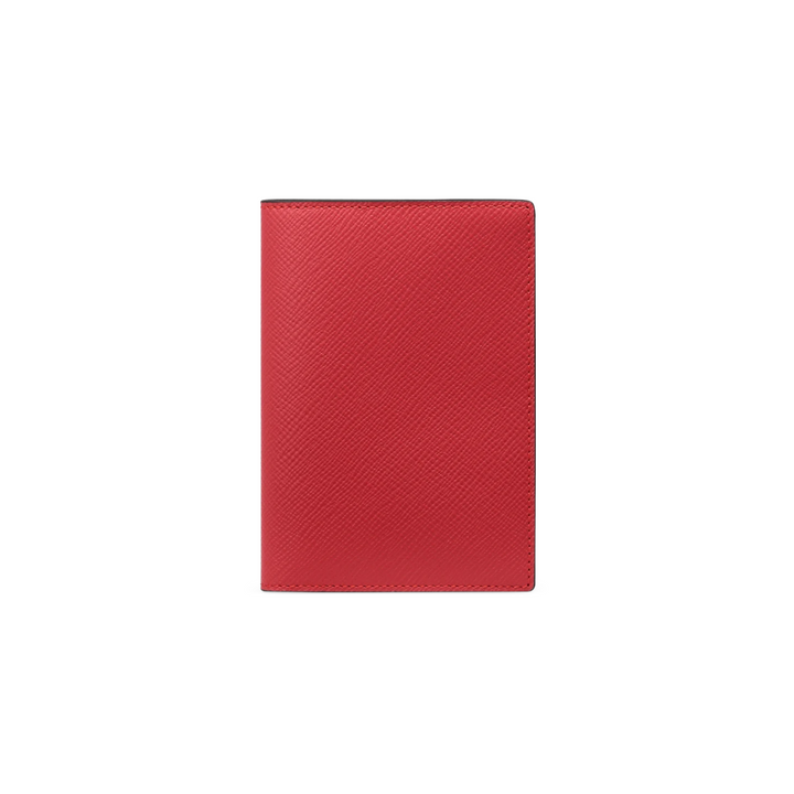 The Tiny Finch red crossgrain leather passport cover with a textured finish and slim travel document design.