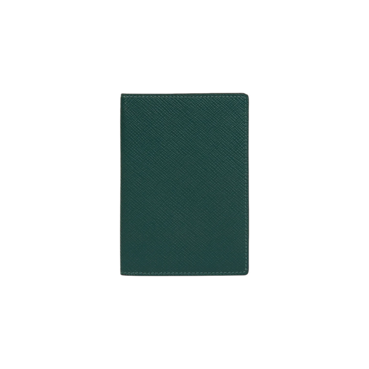 The Tiny Finch forest green crossgrain leather passport cover with a textured finish.