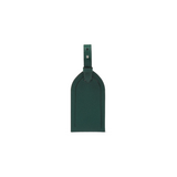The Tiny Finch forest green crossgrain leather luggage tag with an adjustable strap and tonal topstitching.