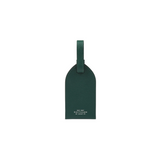 The Tiny Finch Smythson forest green crossgrain leather luggage tag with adjustable strap and tonal topstitching.