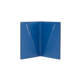The Tiny Finch cerulean blue crossgrain leather passport cover with interior pockets for travel documents.
