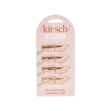 The Tiny Finch set of four creaseless hair clips in a cream colour with a playful red cherry print on recycled plastic