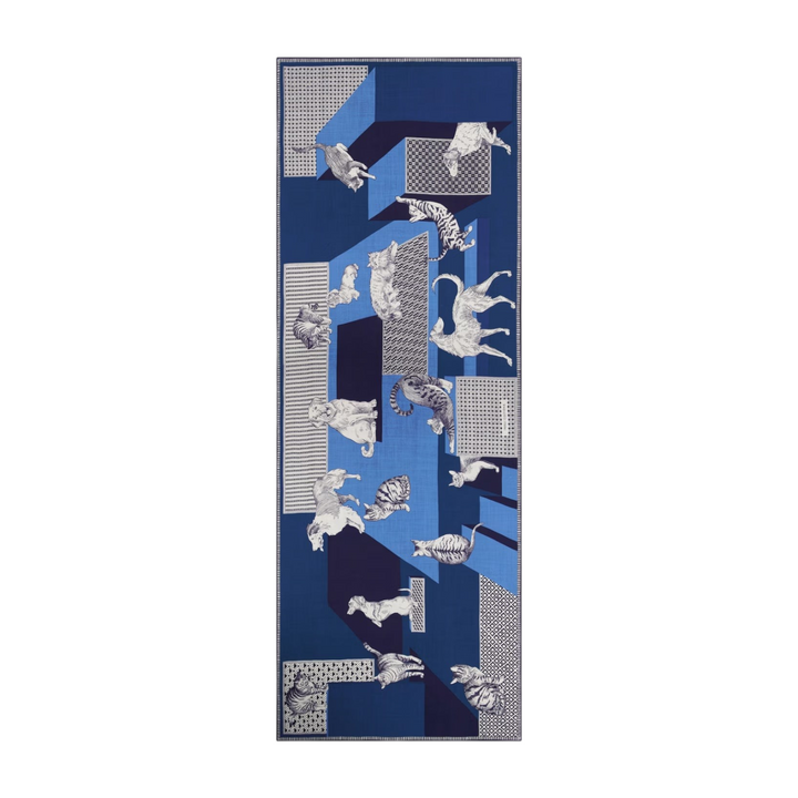 The Tiny Finch Les Cheris blue wool scarf featuring a geometric pattern with illustrated cats and dogs.