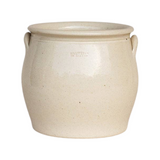 The Tiny Finch large handcrafted stoneware confit pot in a neutral cream glaze with side handles on linen background