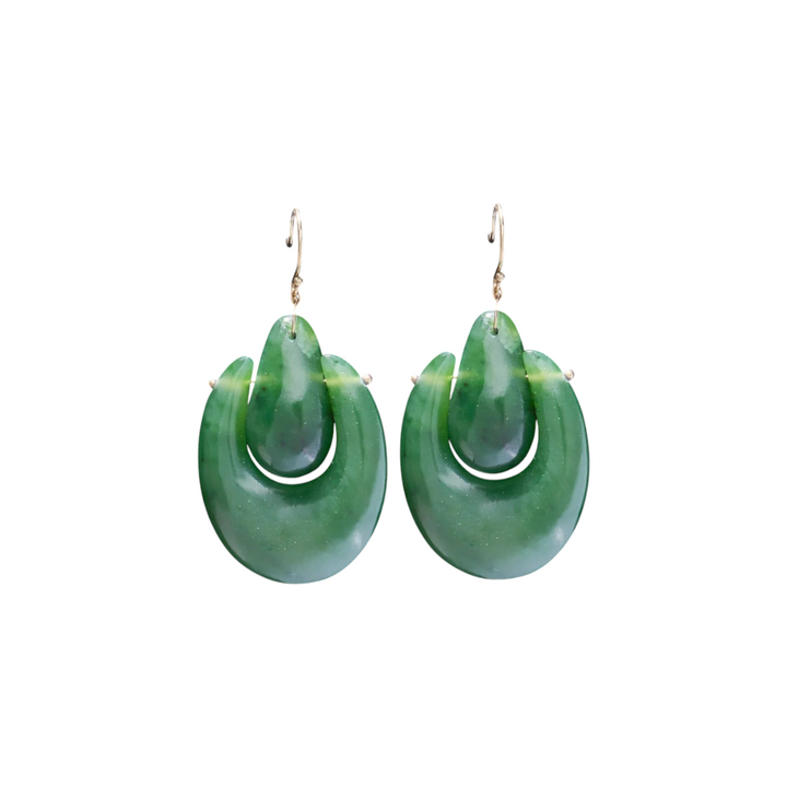 The Tiny Finch Jade O'Keefe earrings featuring hand-cut green jade stones on 18k gold ear wires, handmade in NYC.