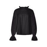 The Tiny Finch Merlette Majorelle black Pima cotton blouse with hand-smocked yoke and ruffled collar and cuffs.