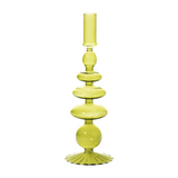 The Tiny Finch Maegen green glass taper candle holder with a decorative stacked orb design on a fluted base.