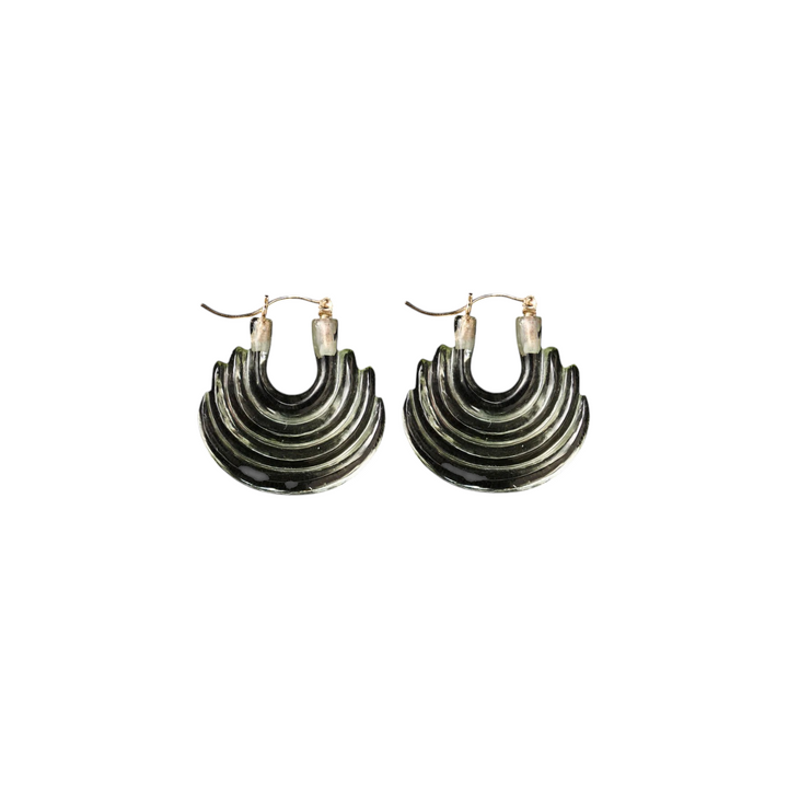 The Tiny Finch green amethyst hand-carved gong hoop earrings on 14k gold wires against a black background.
