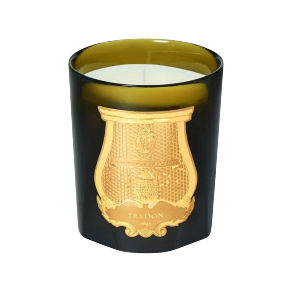 The Tiny Finch Tuileries scented candle in a dark green glass vessel with an ornate gold emblem label.