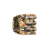 The Tiny Finch Monet mini claw hair clip in a multi-colored Italian bio-acetate tortoiseshell pattern.