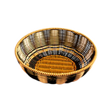 The Tiny Finch Maegen hand-woven bowl in black and cream polypropylene with a textured faux rattan design.