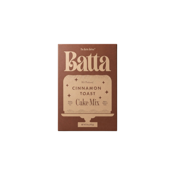 The Tiny Finch Batta Cinnamon Toast cake mix box in brown packaging with elegant typography on a solid brown background
