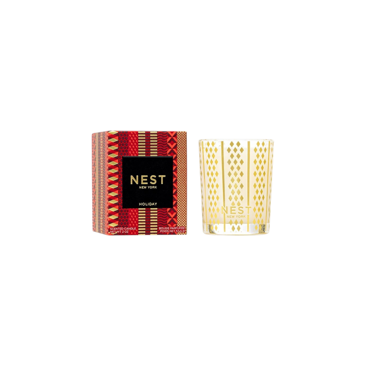 The Tiny Finch Nest Holiday votive candle with a gold patterned glass jar and its decorative red and gold box.