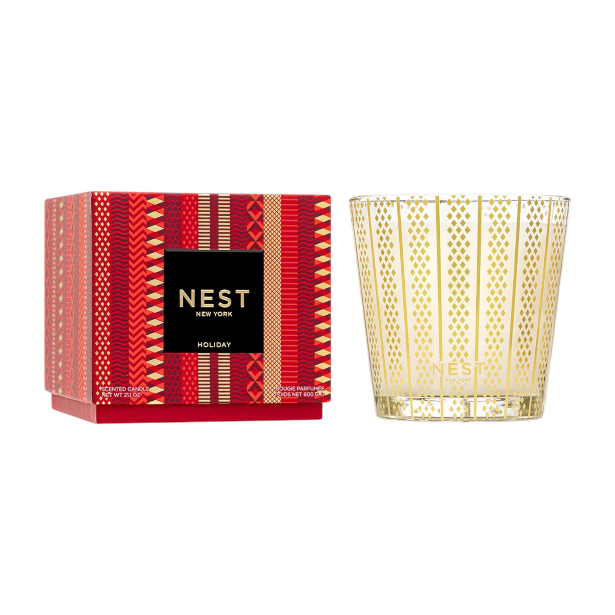 The Tiny Finch Nest Holiday 3-wick scented candle in a gold-patterned glass jar with its festive red gift box.