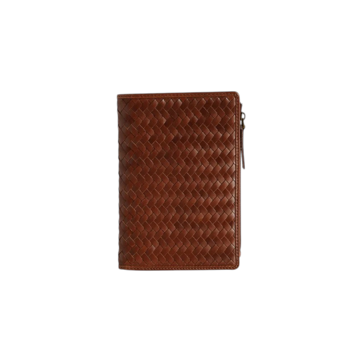 The Tiny Finch Elio travel organizer in sienna brown handwoven leather with multiple internal pockets and zipper.