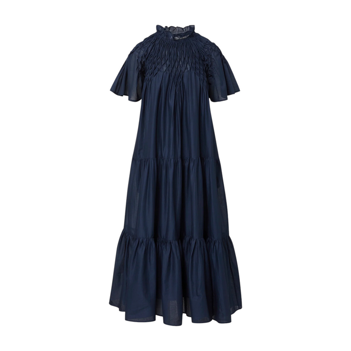 The Tiny Finch Merlette Bejart navy blue cotton voile midi dress with hand-smocked detailing and tiered skirt.