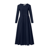 The Tiny Finch Chaouen navy blue long-sleeved midi dress with a gathered waist and simple round neckline.