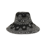 The Tiny Finch black and white cotton capeline hat featuring a detailed paisley bandana print pattern.