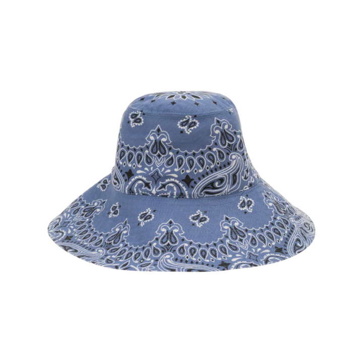 The Tiny Finch blue cotton capeline hat featuring a white and black paisley bandana print pattern.