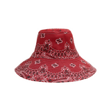 The Tiny Finch vintage red cotton capeline hat featuring a white bandana-style paisley print and stitched brim.