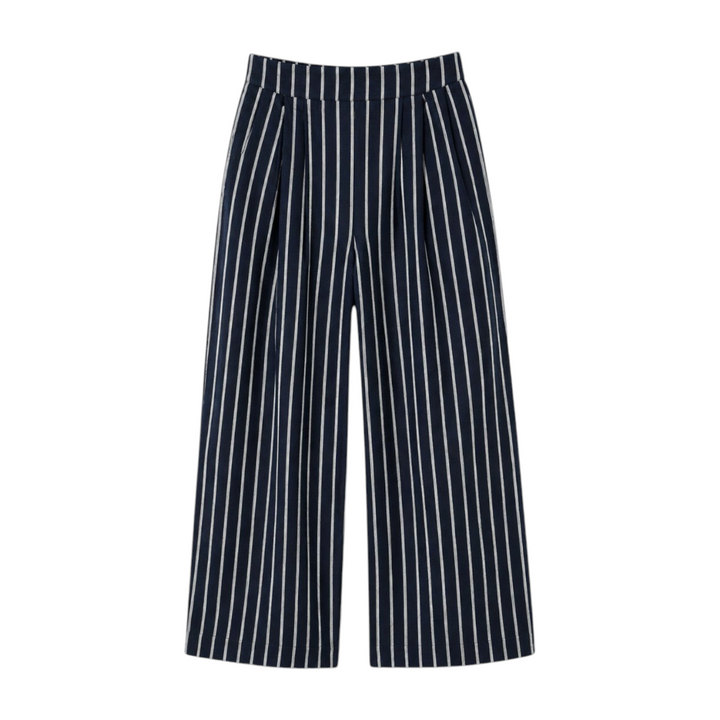 The Tiny Finch Kenny high-rise wide-leg linen pants in navy with white pinstripe detailing.
