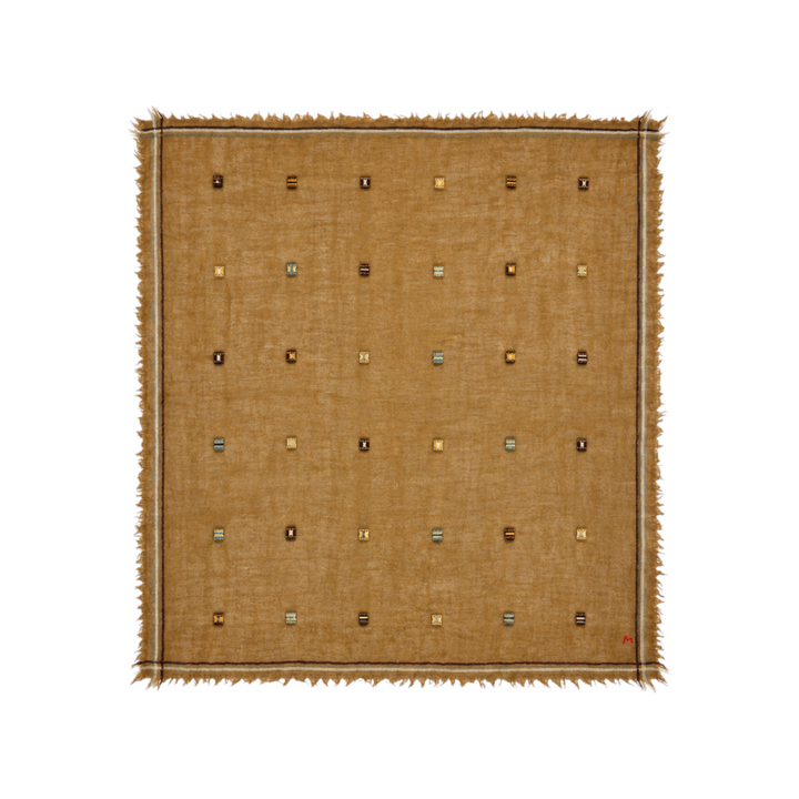 The Tiny Finch Moismont Chelsea henna wool scarf featuring handcrafted jamdani woven flag patterns and fringed edges.
