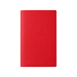 The Tiny Finch Panama pocket notebook in vibrant red crossgrain leather with a textured finish.