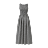 The Tiny Finch Carina black and white gingham maxi dress with a sleeveless shirred bodice and gathered A-line skirt.