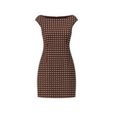 The Tiny Finch brown linen mini dress with white polka dots, featuring an elegant off-the-shoulder neckline.