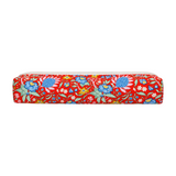 The Tiny Finch Persimmon hair tools bag in a vibrant red floral print with blue and yellow botanical patterns.