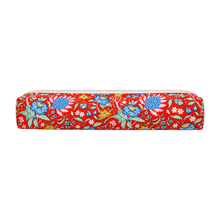 The Tiny Finch Persimmon hair tools bag in a vibrant red floral print with blue and yellow botanical patterns.