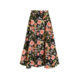 The Tiny Finch Margaret midi skirt in black with a vibrant pink and blue floral print, made from cotton and tencel.