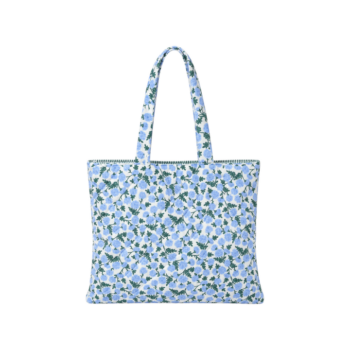The Tiny Finch Dianthus tote bag in light grey fabric with blue and green floral print and dark green striped lining.