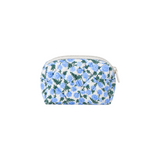 The Tiny Finch Dianthus mini cosmetic bag in light grey fabric with a blue floral print and quilted texture.