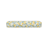 The Tiny Finch Daisy Fields regular hair tools bag in yellow fabric with a vibrant blue, green, and white floral print.