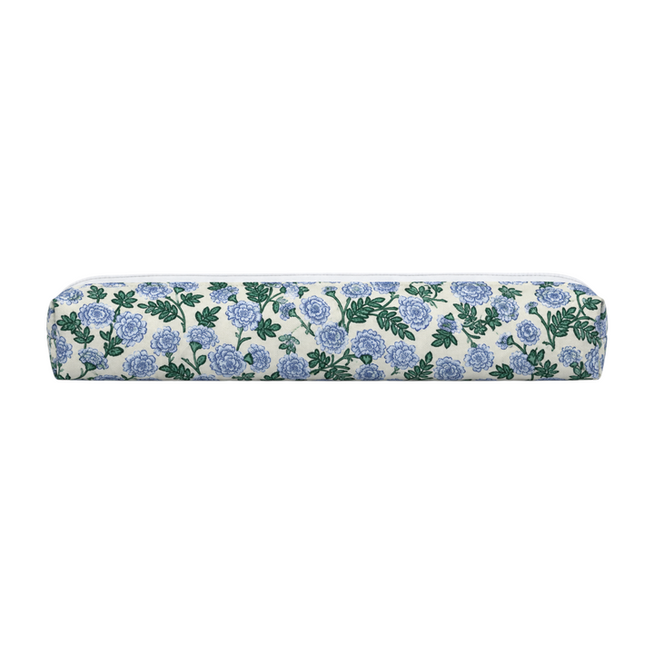 The Tiny Finch Dianthus hair tools bag featuring a blue and green floral print on a cream fabric background.