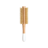 The Tiny Finch round hair brush with boar bristles and nylon pins on a light wood handle for volume and shine