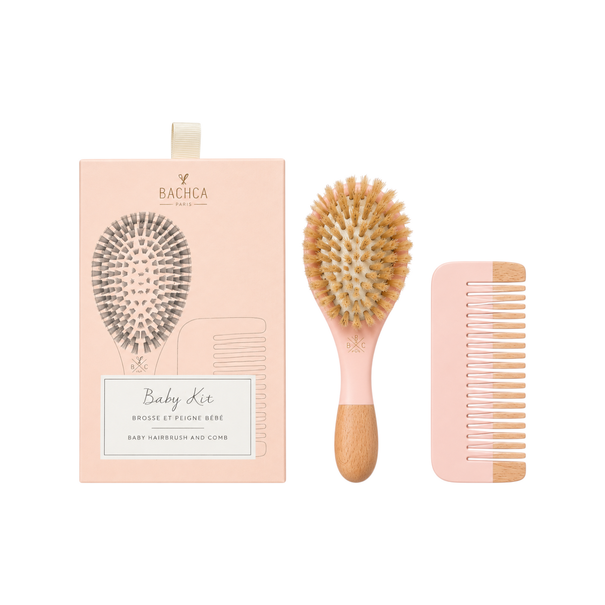 The Tiny Finch baby haircare gift set featuring a soft boar bristle brush and beechwood comb in a pink box.