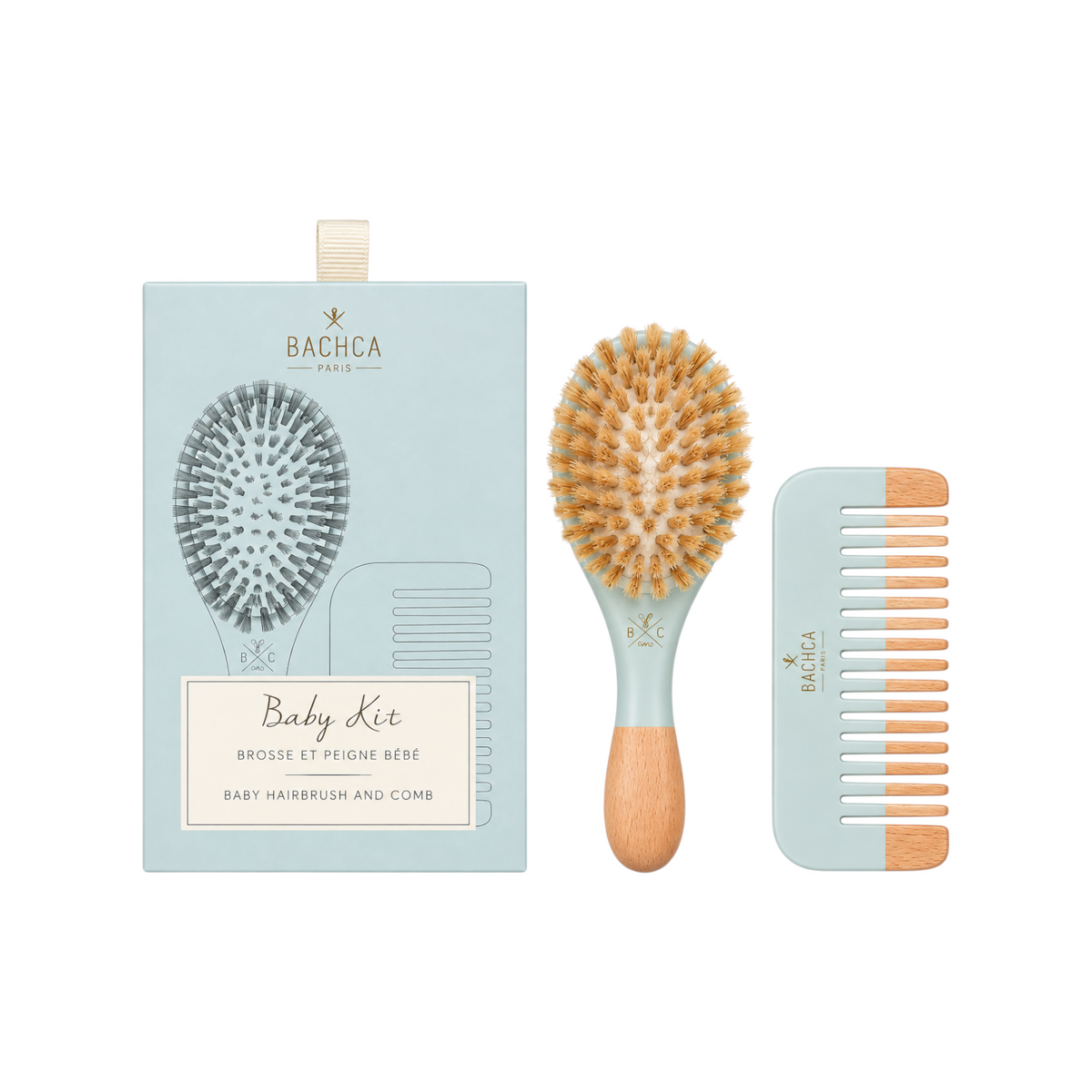 The Tiny Finch baby haircare gift set featuring a soft boar bristle brush and beechwood comb in a light blue box.