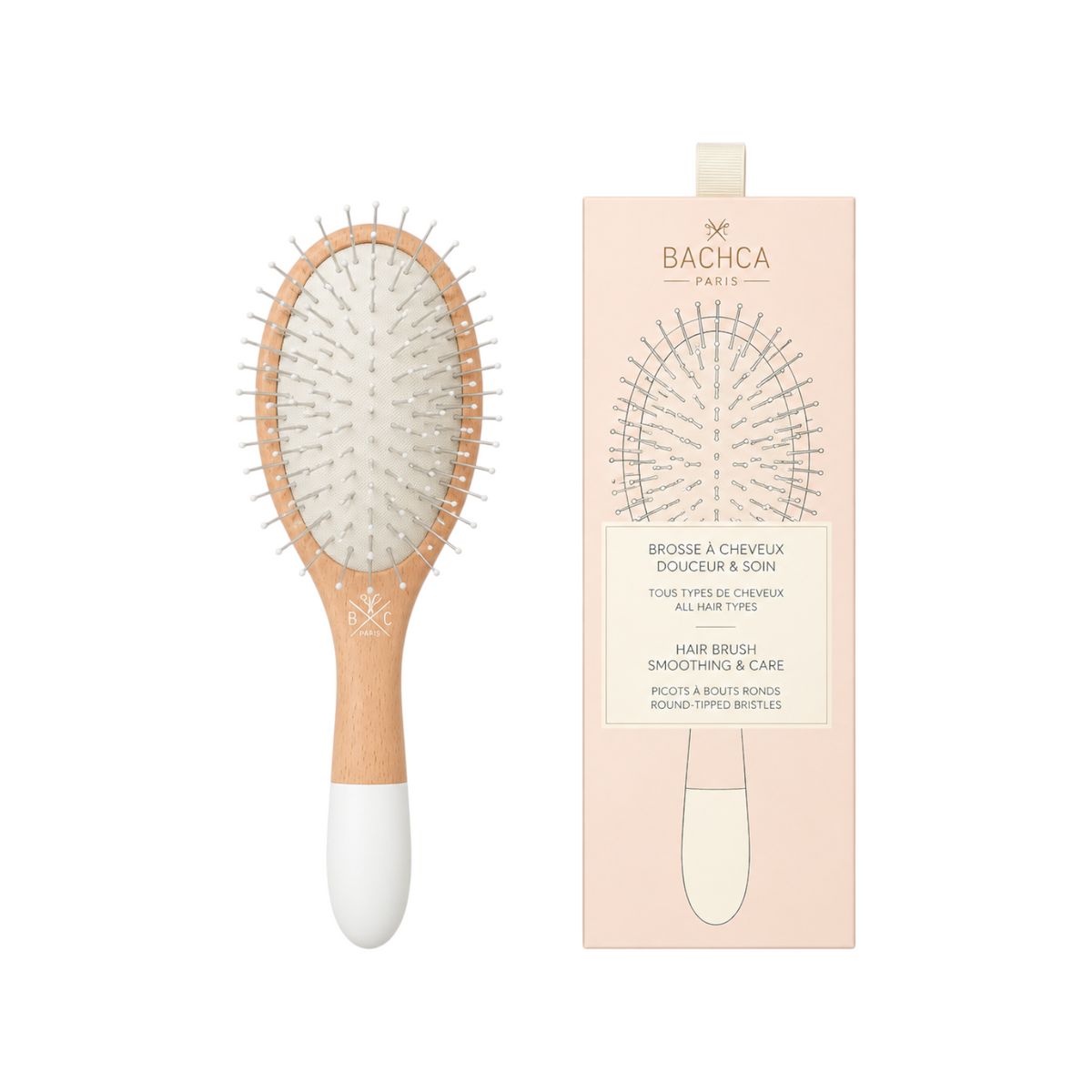 The Tiny Finch large detangling hair brush with a wooden handle and flexible nylon pins in its branded packaging.