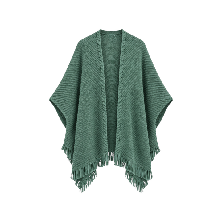 The Tiny Finch vine green knit cardigan poncho with a ribbed texture and fringe hem detail.