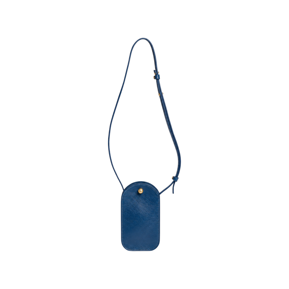 The Tiny Finch Segui Indigo crossbody bag in deep blue leather with an adjustable strap and gold stud closure.