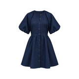The Tiny Finch Bastille Midnight short linen dress in navy blue with puff sleeves and a button-down front.