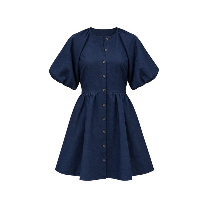 The Tiny Finch Bastille Midnight short linen dress in navy blue with puff sleeves and a button-down front.