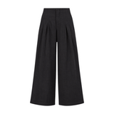 The Tiny Finch Sabi black wide-leg linen pants with a high waist, front pleats, and a comfortable elastic back.